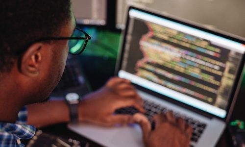 black-male-in-front-of-computer-screen-coding-mobi-2022-11-15-06-43-22-utc