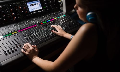 female-audio-engineer-using-sound-mixer-2021-08-28-22-12-32-utc